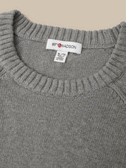 Close-up of a gray ribbed knit sweater neck with a visible white 89th & Madison brand label.