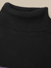 Close-up of a black ribbed knit turtleneck sweater against a light beige background.