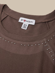 Close-up of a brown scoop-neck top with silver rhinestone trim along the neckline, showing the 89th & Madison brand label.