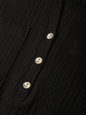 Close-up of a black ribbed button-up shirt featuring three decorative gold-toned floral buttons.